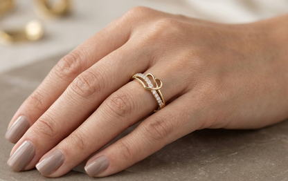 18K yellow gold open heart diamond ring featuring 0.21 carat natural round brilliant diamonds in a contemporary flowing design.