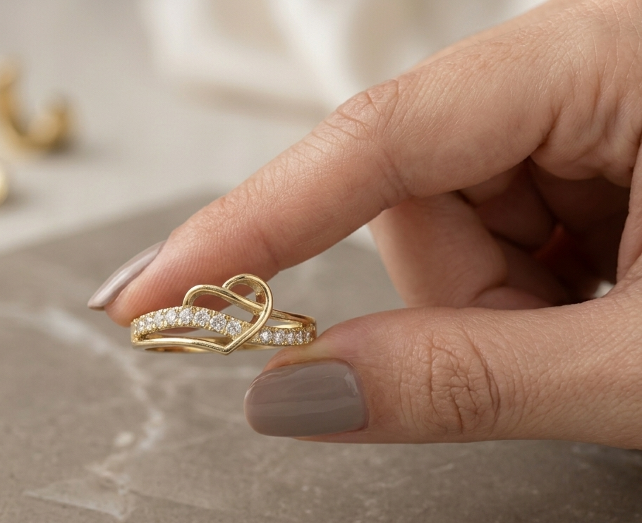 18K yellow gold open heart diamond ring featuring 0.21 carat natural round brilliant diamonds in a contemporary flowing design.