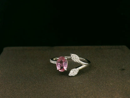 18k white gold ring with 0.83ct oval pink sapphire & 0.16ct diamond-accented leaf motif – certificate included