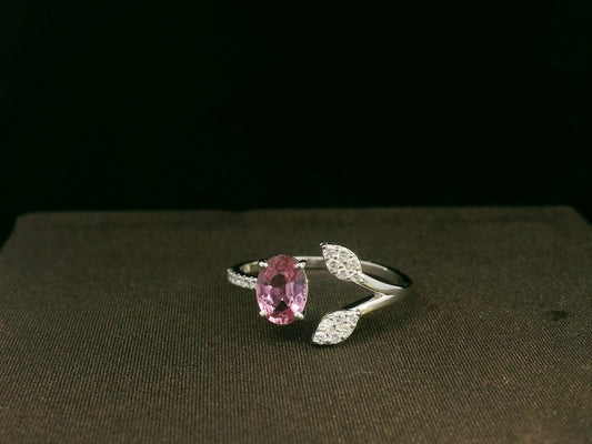 18k white gold ring with 0.83ct oval pink sapphire & 0.16ct diamond-accented leaf motif – certificate included