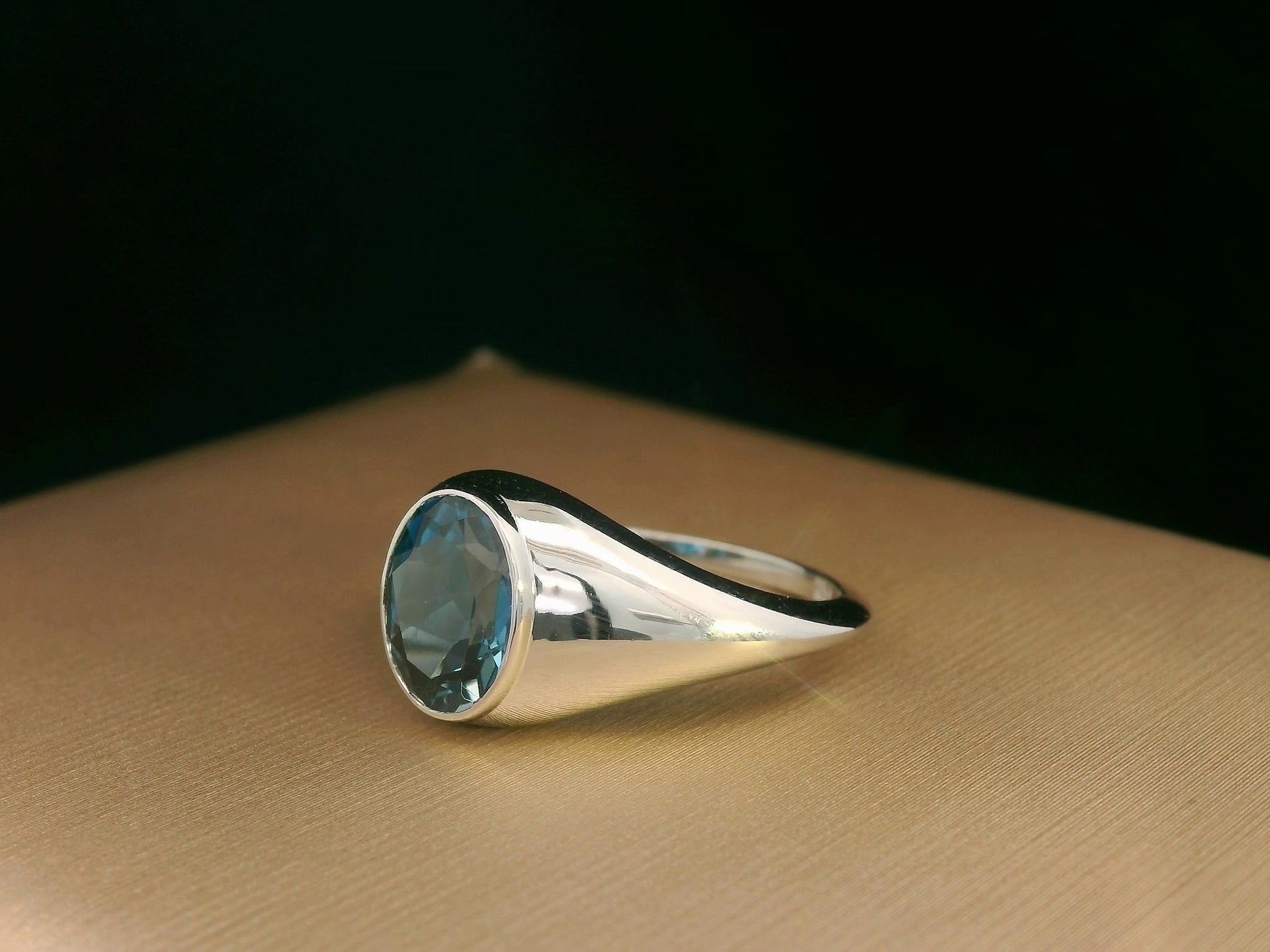 18k white gold ring with 2.13ct oval London Blue Topaz in modern bezel setting – certificate included