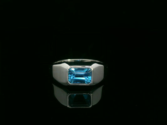 18k white gold ring with 1.26ct emerald-cut blue topaz in modern bezel setting – certificate included