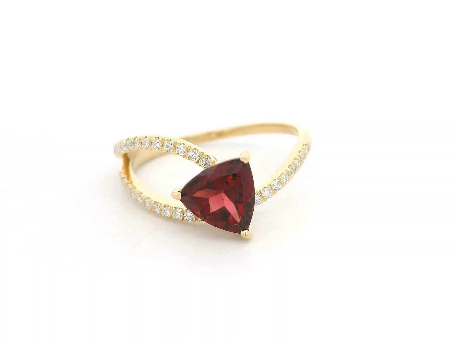 18k yellow gold ring with trillion-cut garnet and diamond crossover band. Comes with a certificate of authenticity