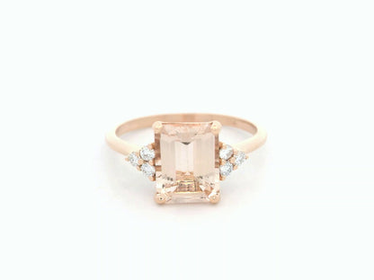 18K rose gold ring featuring a 1.80ct emerald-cut Morganite with diamond clusters on each side.