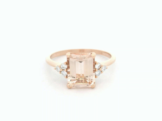 18K rose gold ring featuring a 1.80ct emerald-cut Morganite with diamond clusters on each side.