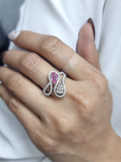18k white gold ring with 0.74ct pear-shaped pink sapphire and 0.59ct diamonds in a sculptural double-drop design.
