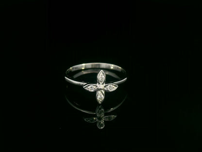 18k gold ring featuring a floral motif with four marquise-shaped diamonds forming a cross, set on a slim minimalist band for modern elegance