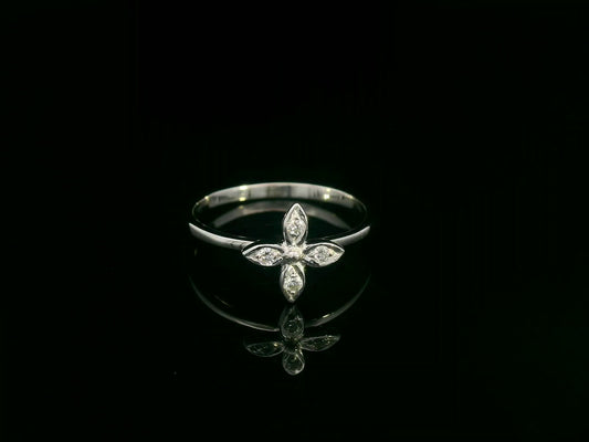 18k gold ring featuring a floral motif with four marquise-shaped diamonds forming a cross, set on a slim minimalist band for modern elegance
