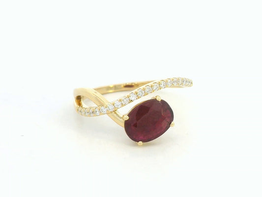 18K yellow gold oval ruby bypass ring with round diamond accents, modern luxury design