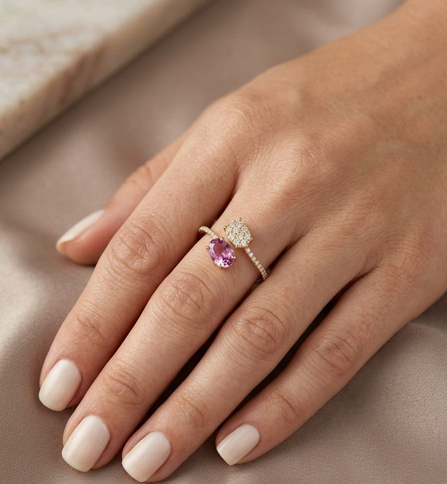 18K yellow gold Toi et Moi ring featuring a 1.35 carat oval rhodolite garnet, oval diamond cluster and 0.37 carats of natural diamonds.
