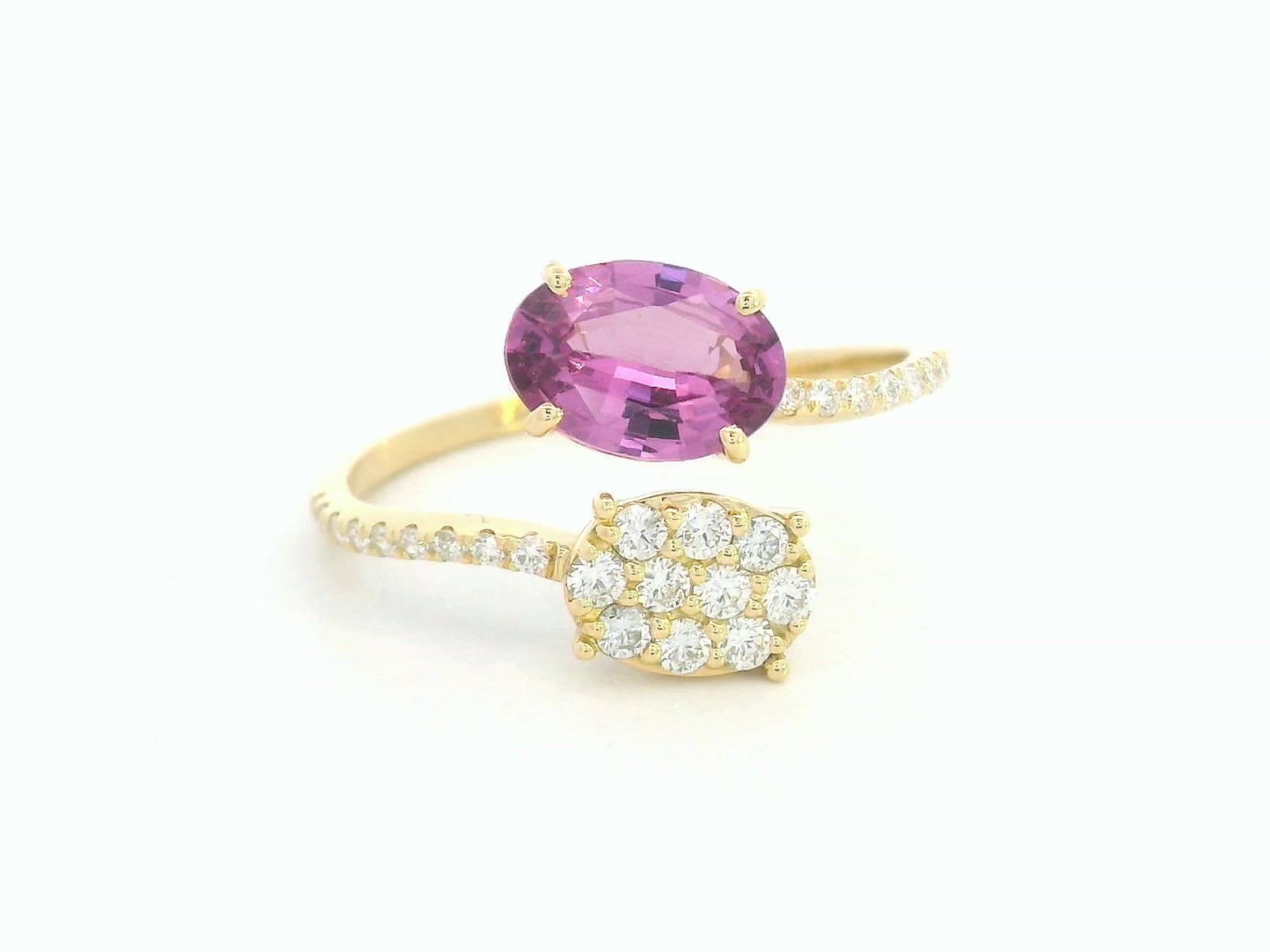 18K yellow gold oval rhodolite garnet bypass ring with pavé diamond accents, modern luxury design