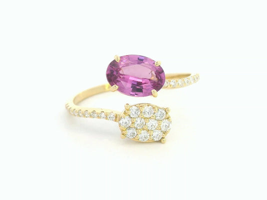 18K yellow gold oval rhodolite garnet bypass ring with pavé diamond accents, modern luxury design