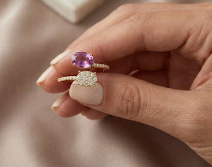 18K yellow gold Toi et Moi ring featuring a 1.35 carat oval rhodolite garnet, oval diamond cluster and 0.37 carats of natural diamonds.