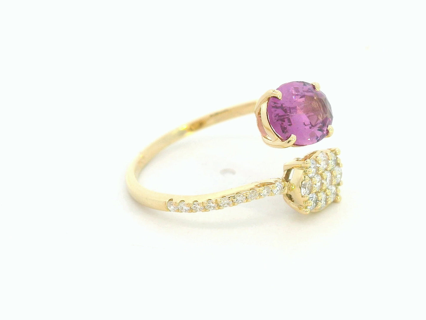 18K yellow gold oval rhodolite garnet bypass ring with pavé diamond accents, modern luxury design