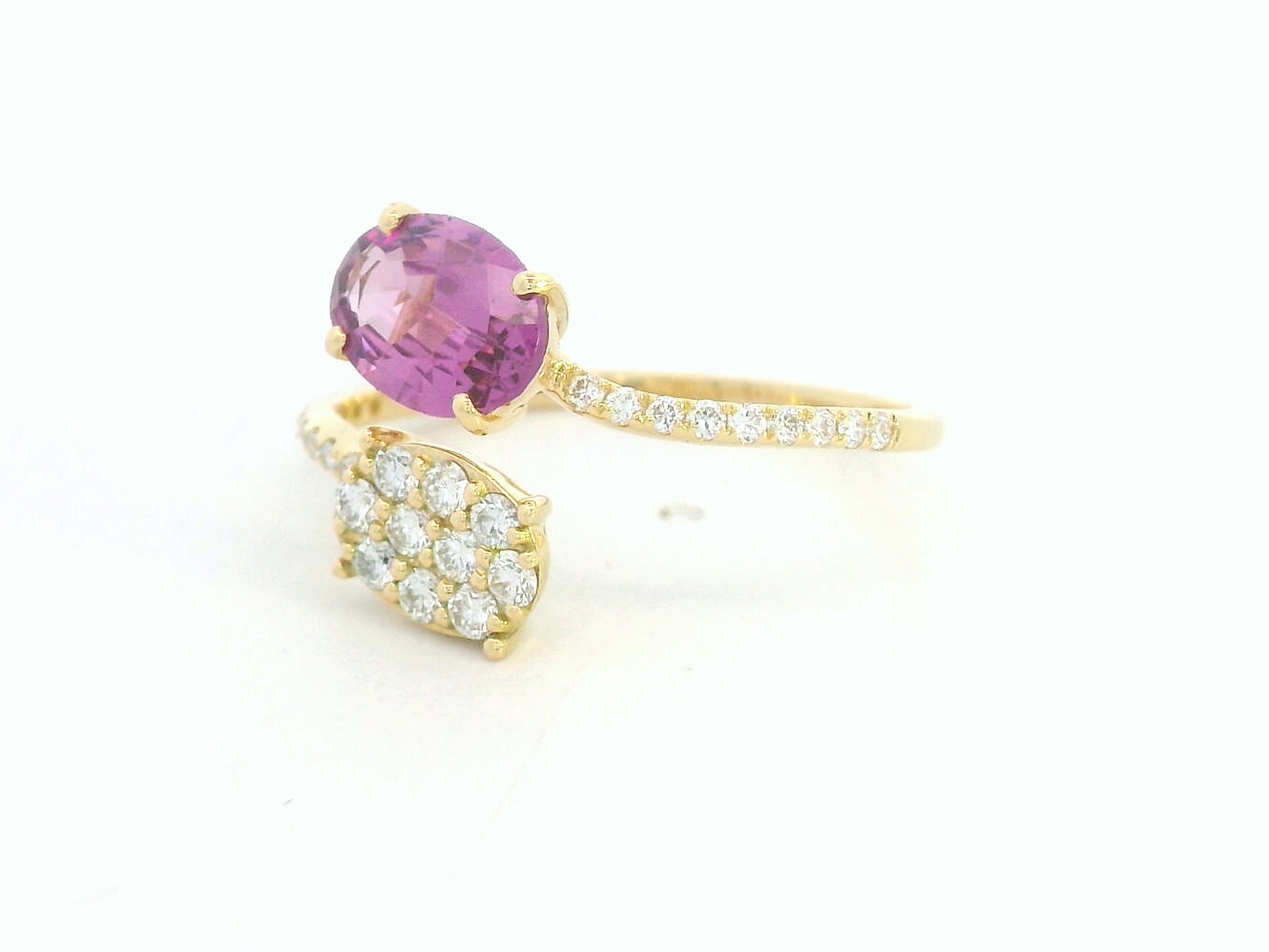 18K yellow gold oval rhodolite garnet bypass ring with pavé diamond accents, modern luxury design