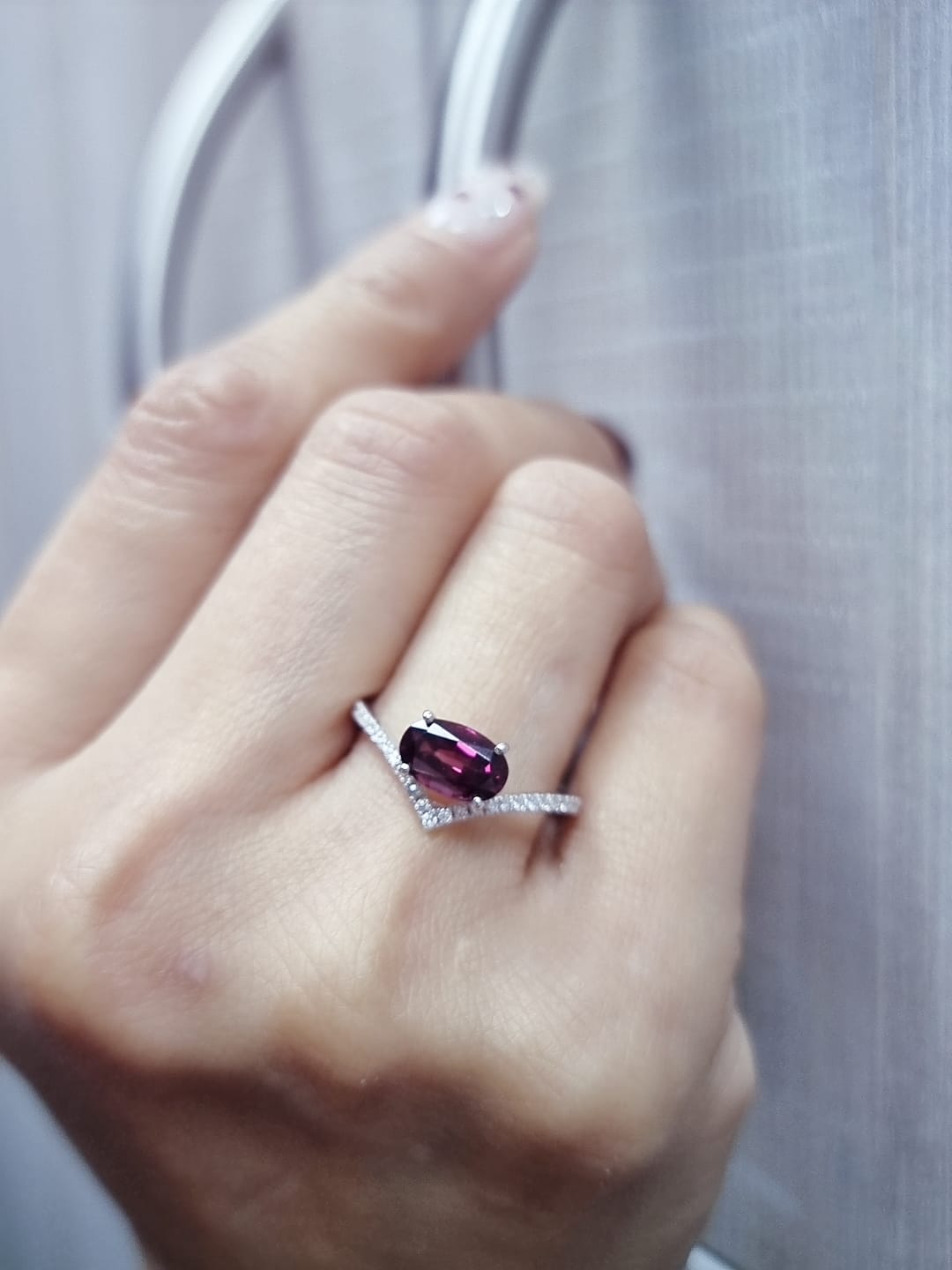 18K gold wishbone ring with oval rhodolite garnet and pavé diamonds