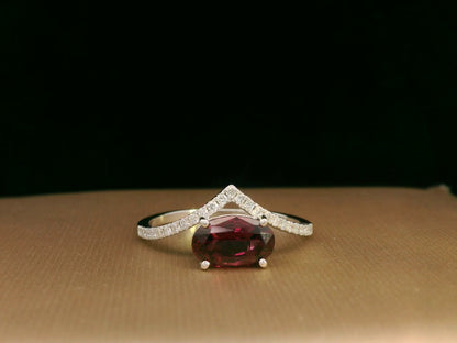 18K gold wishbone ring with oval rhodolite garnet and pavé diamonds, modern luxury design
