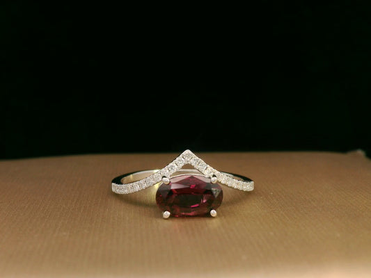 18K gold wishbone ring with oval rhodolite garnet and pavé diamonds, modern luxury design