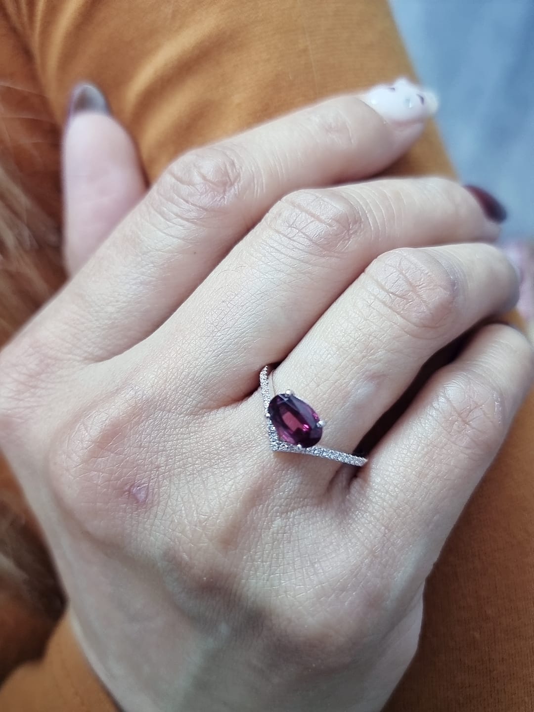 18K gold wishbone ring with oval rhodolite garnet and pavé diamonds
