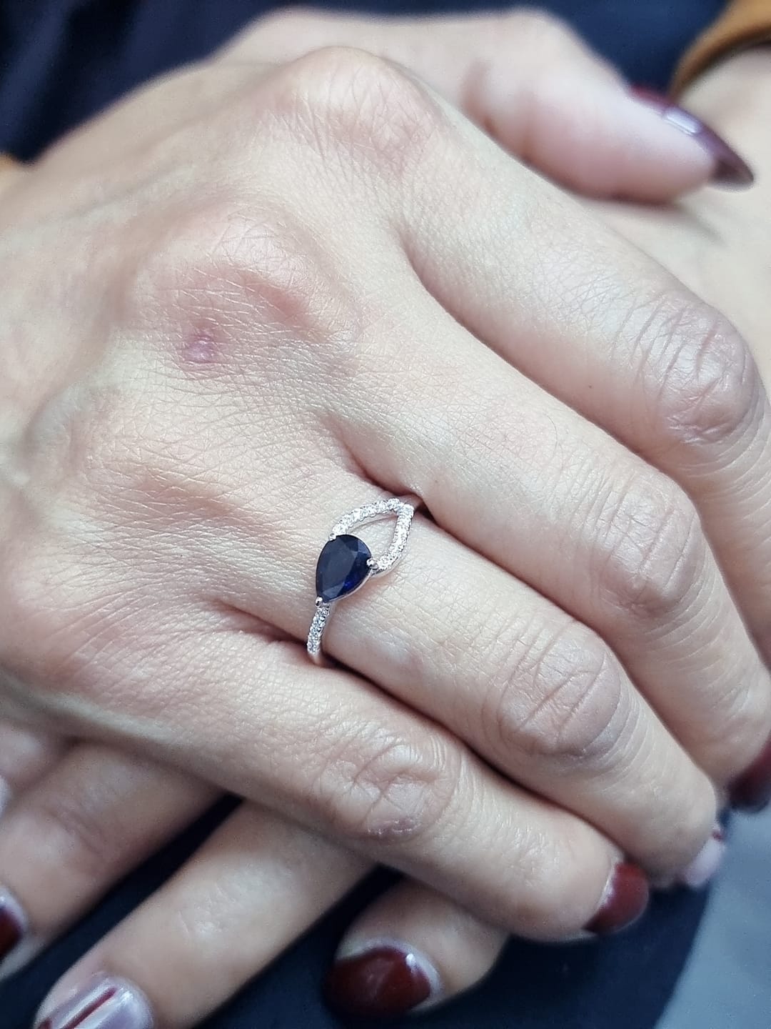 18K white gold asymmetrical ring with 0.78 carat pear-shaped blue sapphire and pavé diamonds, elegant contemporary design
