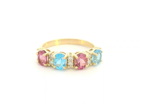 18K yellow gold band with alternating oval pink and blue sapphires and round diamond accents