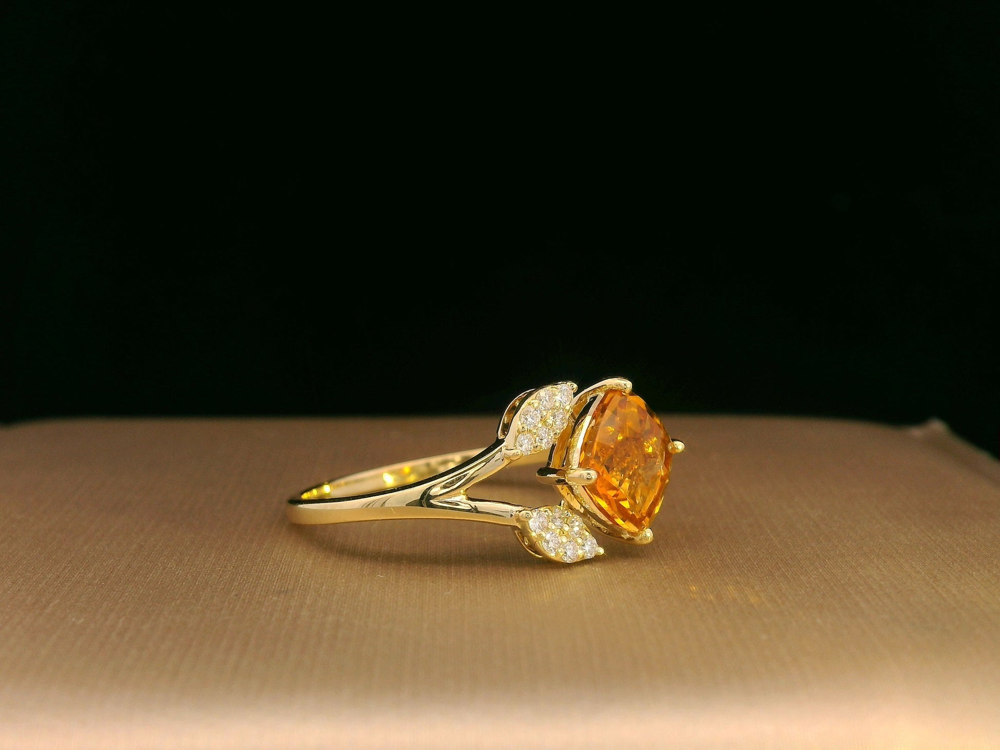 18K yellow gold ring featuring a 1.33ct cushion citrine with diamond leaf design, nature-inspired luxury style.
