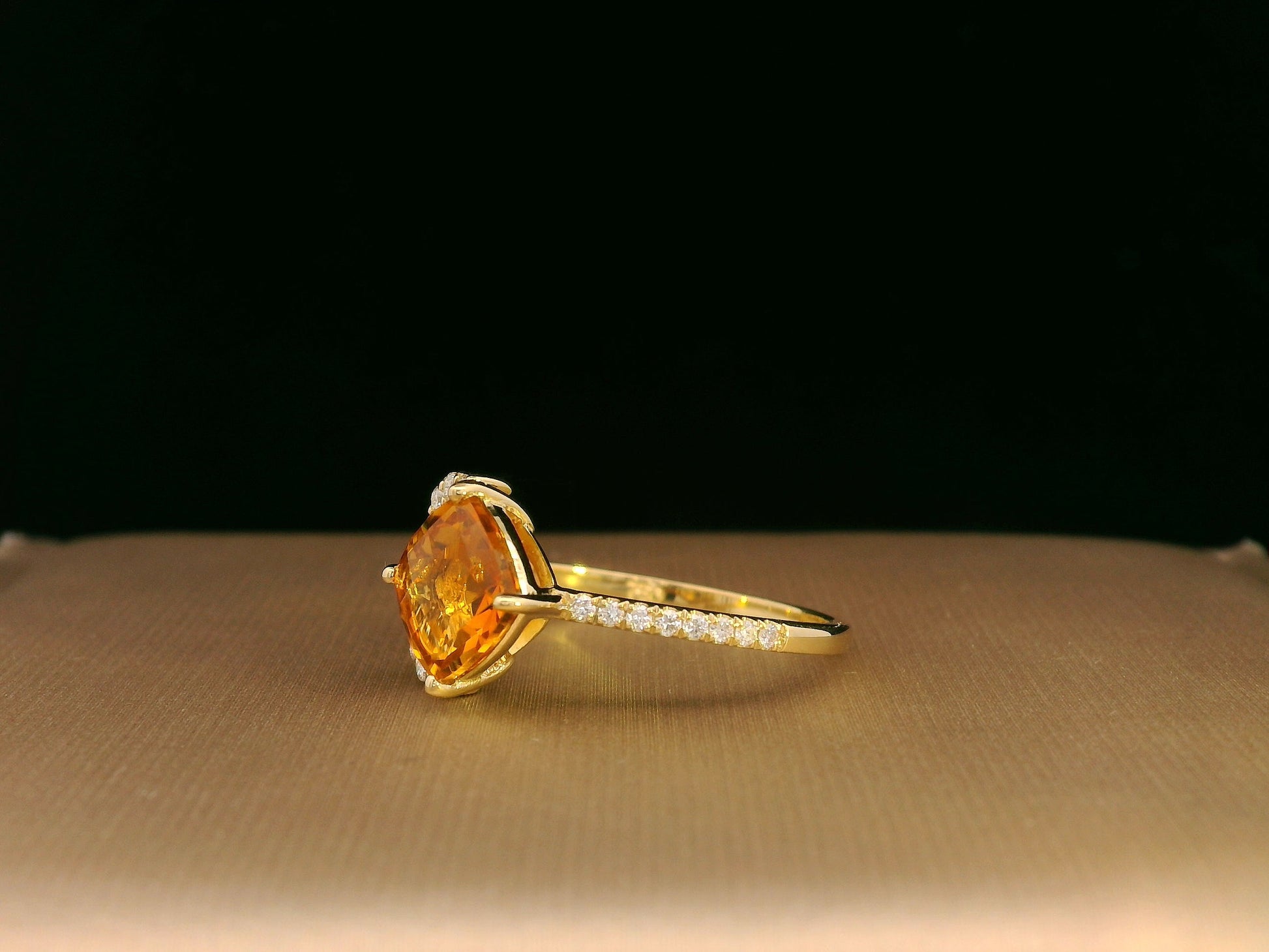 18K yellow gold ring featuring a 1.33ct cushion citrine with diamond leaf design, nature-inspired luxury style.