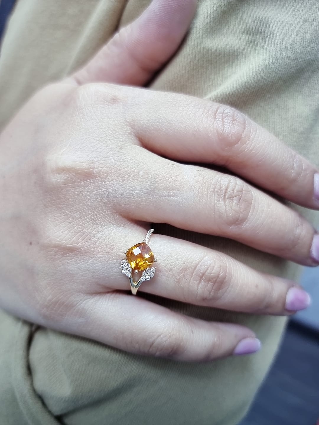 18K yellow gold ring featuring a 1.33ct cushion citrine with diamond leaf design, nature-inspired luxury style.