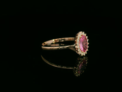 18K rose gold oval pink sapphire and diamond halo ring – fine jewelry by Emirates Diamonds.