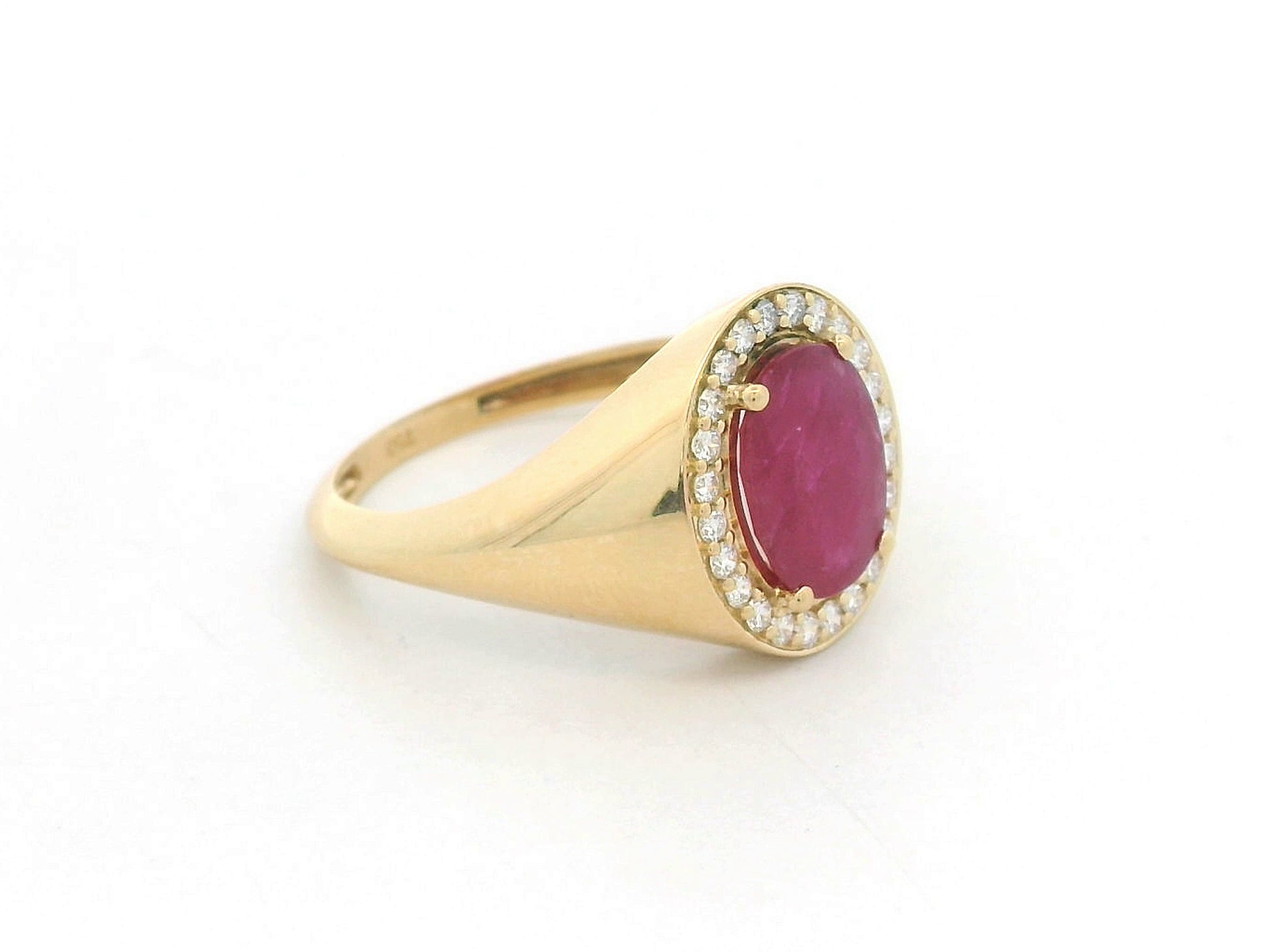 Men’s 18K yellow gold ring featuring 2.58 ct oval ruby with diamond halo and tapered band