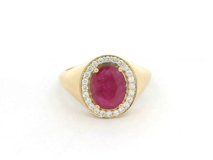 Men’s 18K yellow gold ring featuring 2.58 ct oval ruby with diamond halo and tapered band