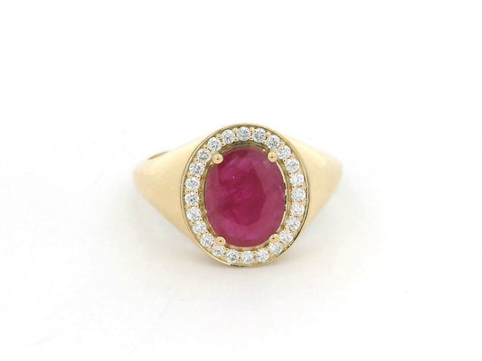 Men’s 18K yellow gold ring featuring 2.58 ct oval ruby with diamond halo and tapered band