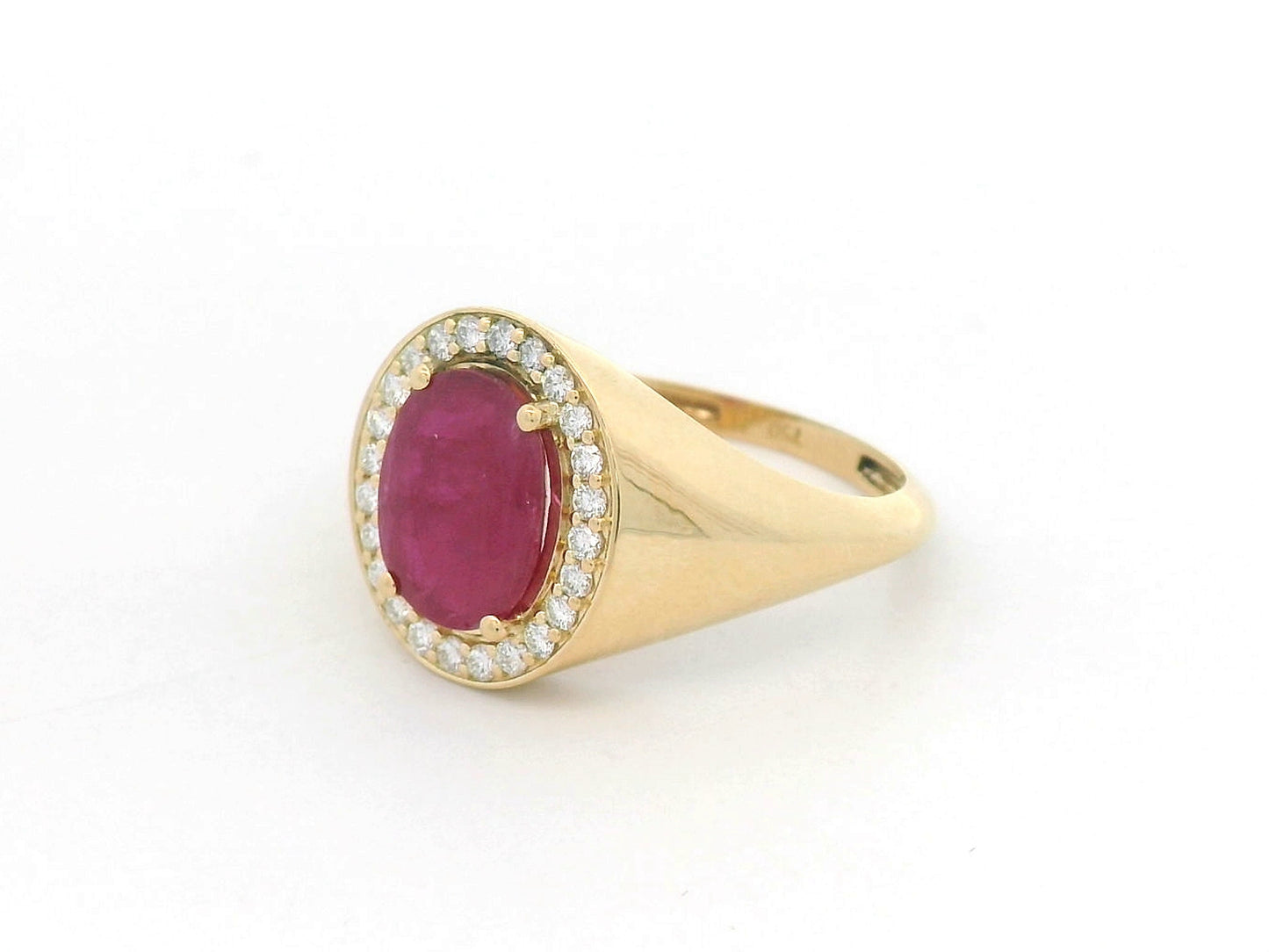 Men’s 18K yellow gold ring featuring 2.58 ct oval ruby with diamond halo and tapered band