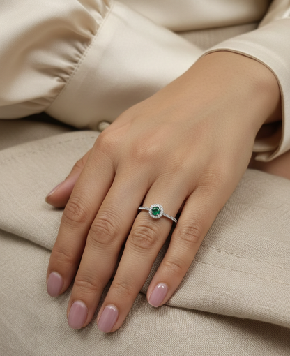 18K white gold emerald and diamond halo ring with 0.20ct round emerald and 0.28ct diamonds – Emirates Diamonds