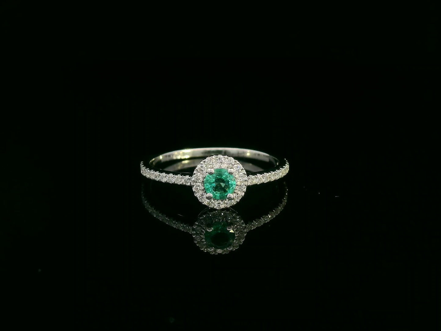18K white gold emerald and diamond halo ring with 0.20ct round emerald and 0.28ct diamonds – Emirates Diamonds