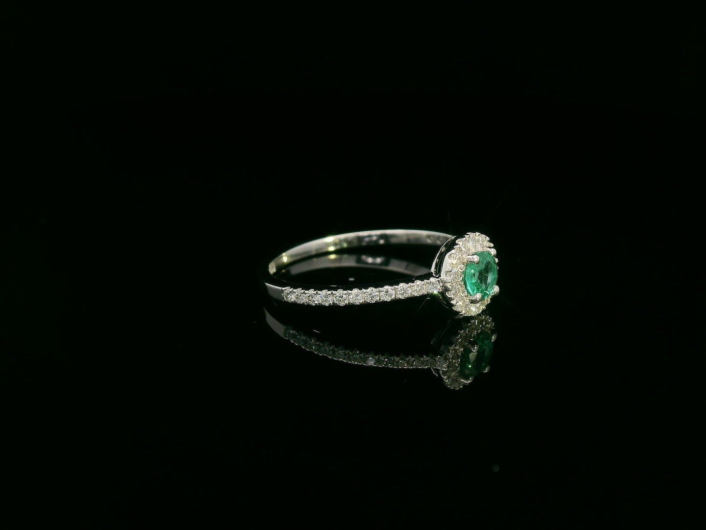 18K white gold emerald and diamond halo ring with 0.20ct round emerald and 0.28ct diamonds – Emirates Diamonds