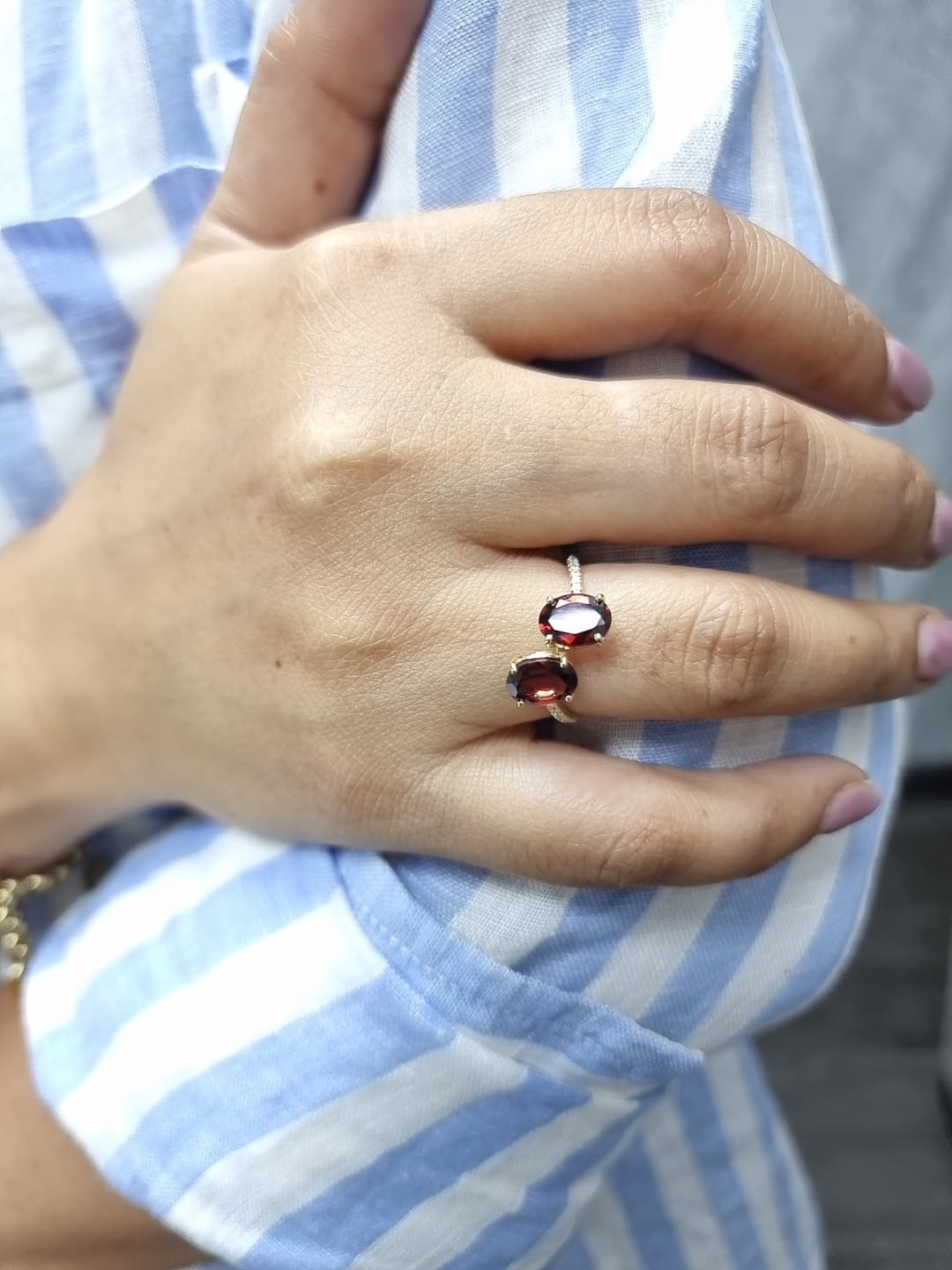 18K yellow gold men’s garnet toi et moi bypass ring with 2.62ct oval garnets and 0.12ct pavé diamonds