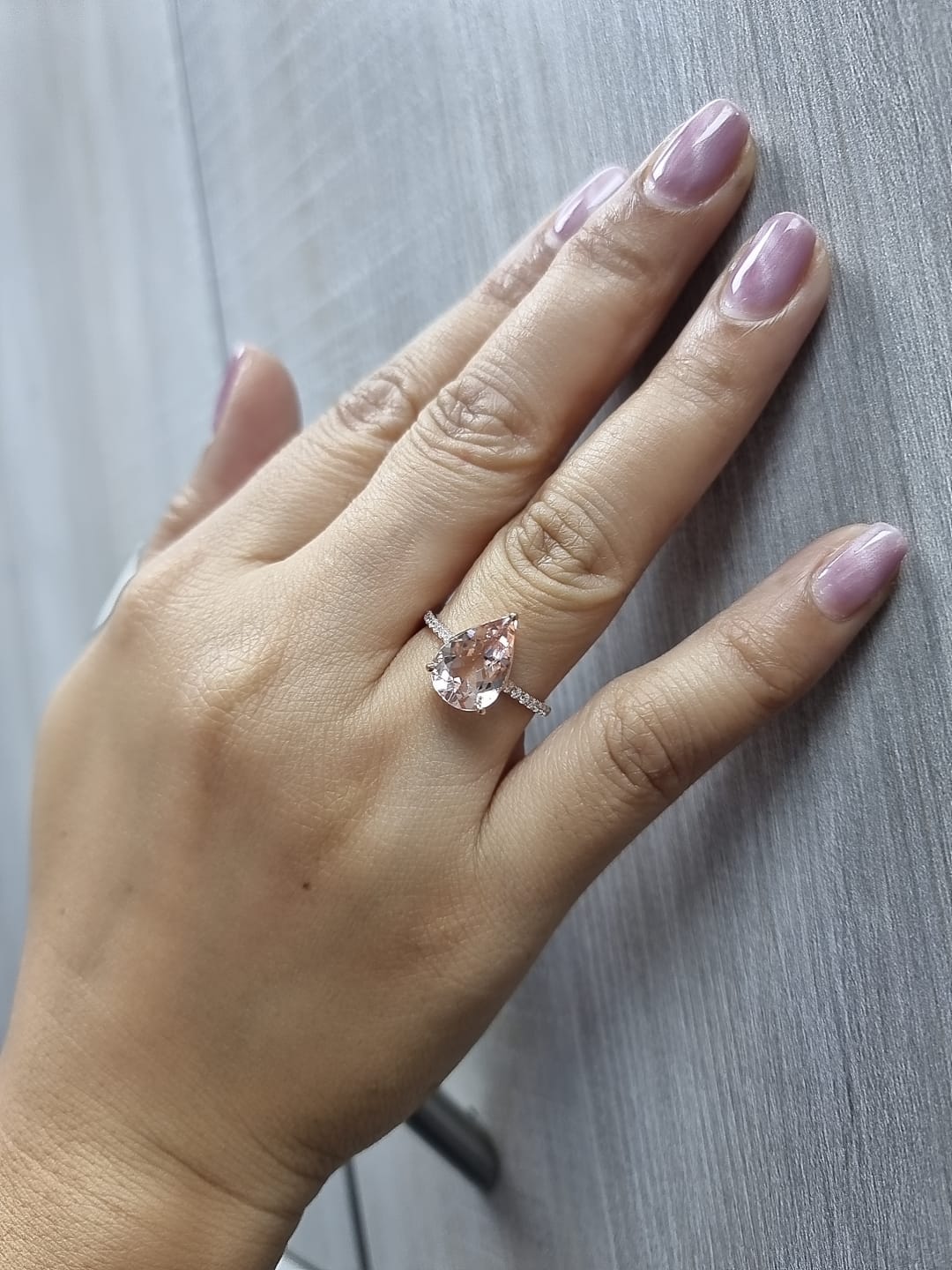 2.97 ct pear-cut morganite ring in 18K rose gold with pavé-set diamond band