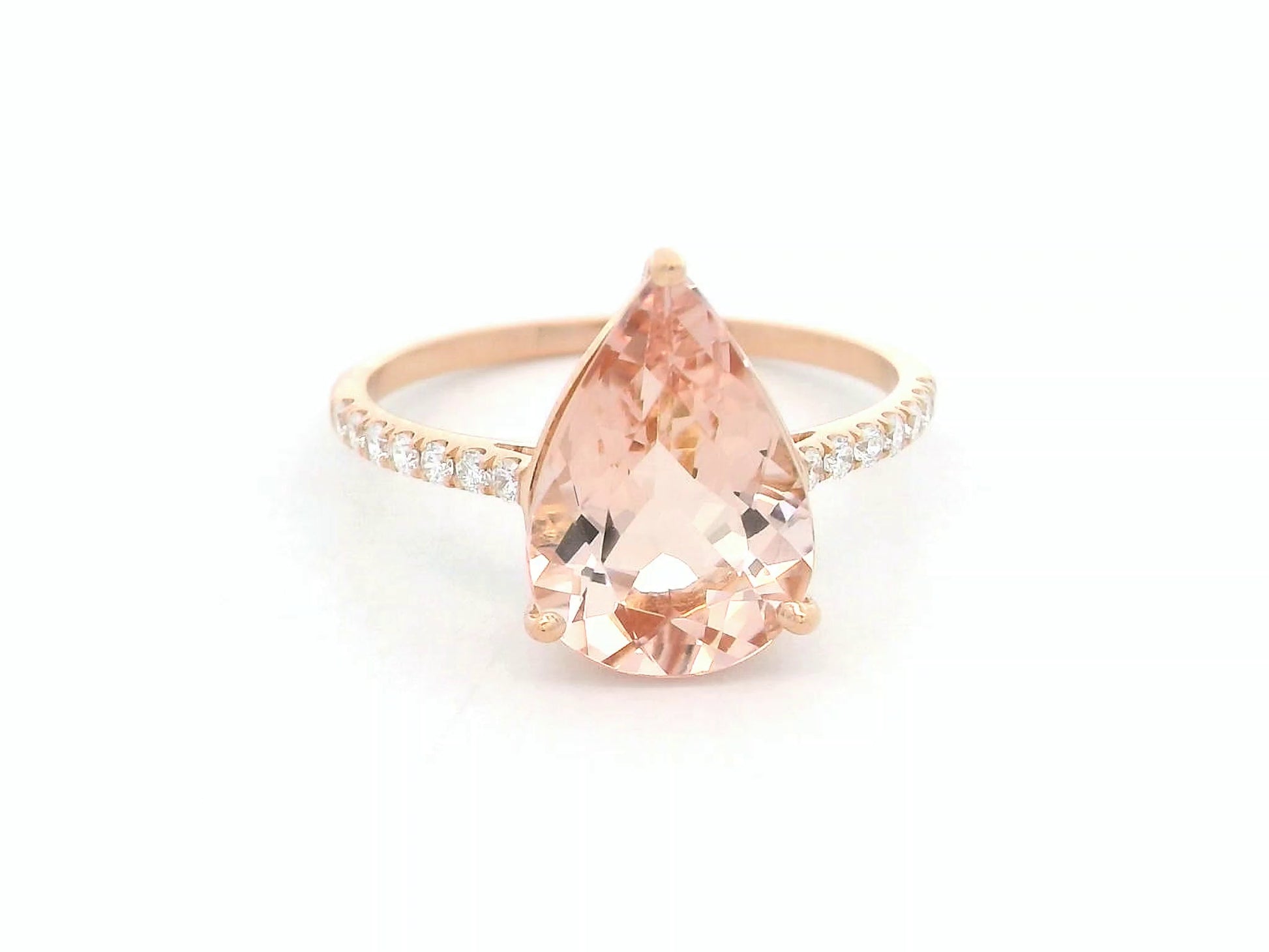 2.97 ct pear-cut morganite ring in 18K rose gold with pavé-set diamond band