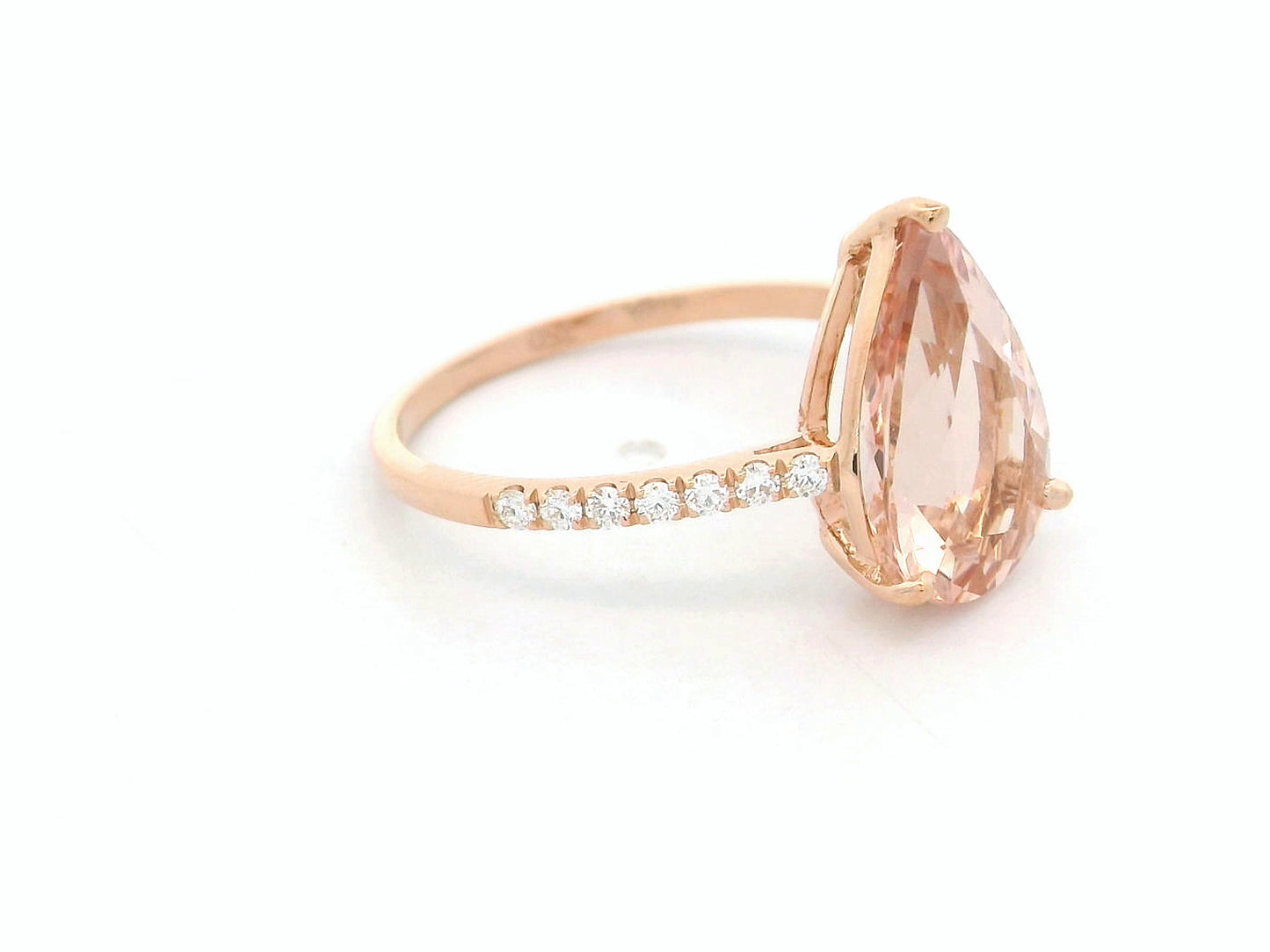 2.97 ct pear-cut morganite ring in 18K rose gold with pavé-set diamond band