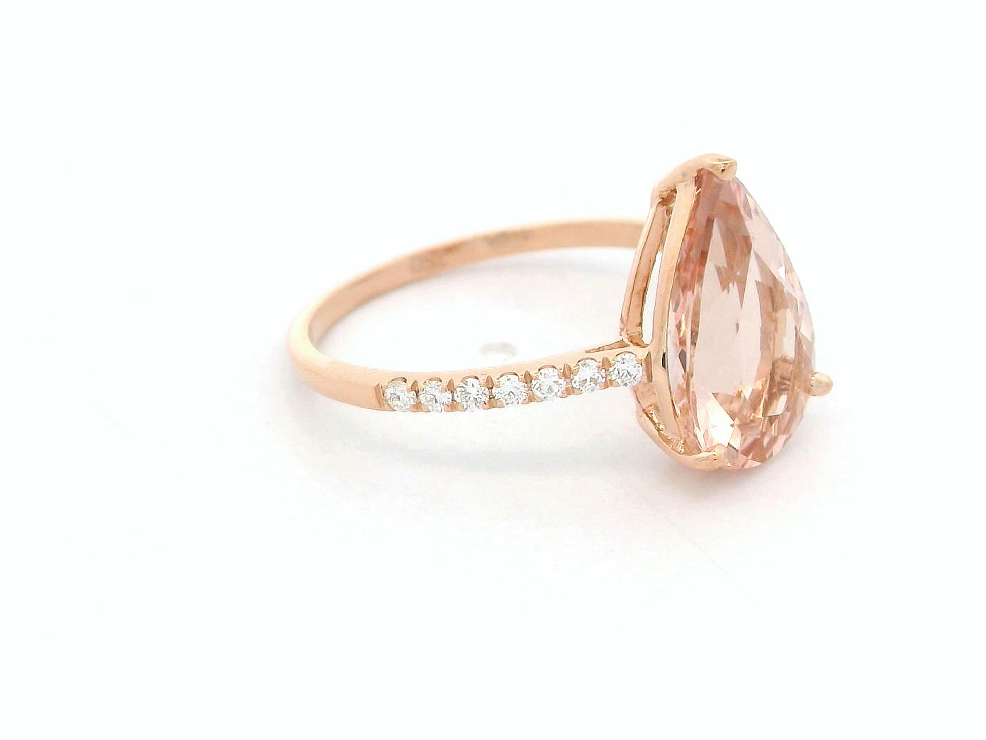 2.97 ct pear-cut morganite ring in 18K rose gold with pavé-set diamond band