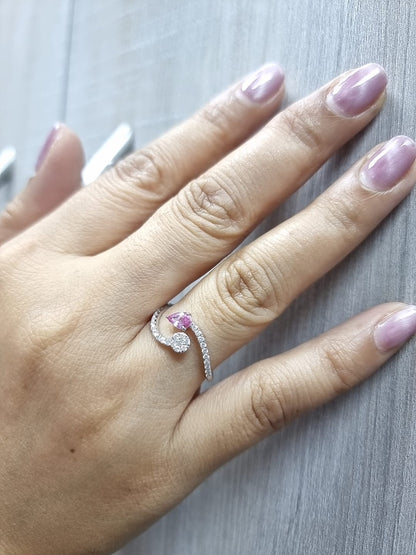 18K white gold bypass ring with pear-cut pink sapphire and diamond cluster