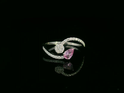 18K white gold bypass ring with pear-cut pink sapphire and diamond cluster