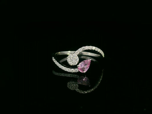 18K white gold bypass ring with pear-cut pink sapphire and diamond cluster