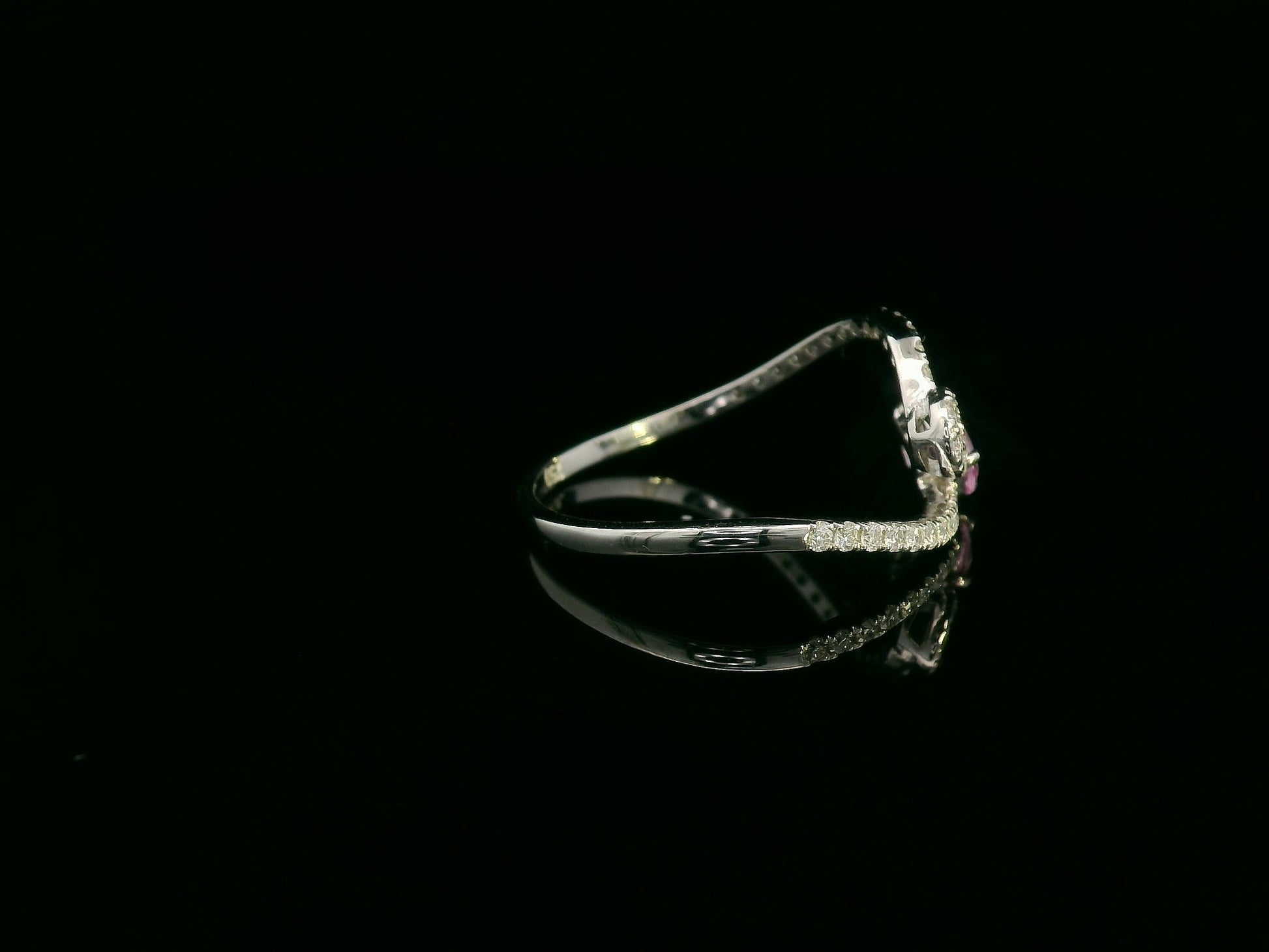 18K white gold bypass ring with pear-cut pink sapphire and diamond cluster