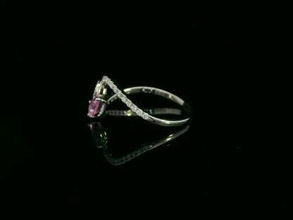 18K white gold bypass ring with pear-cut pink sapphire and diamond cluster