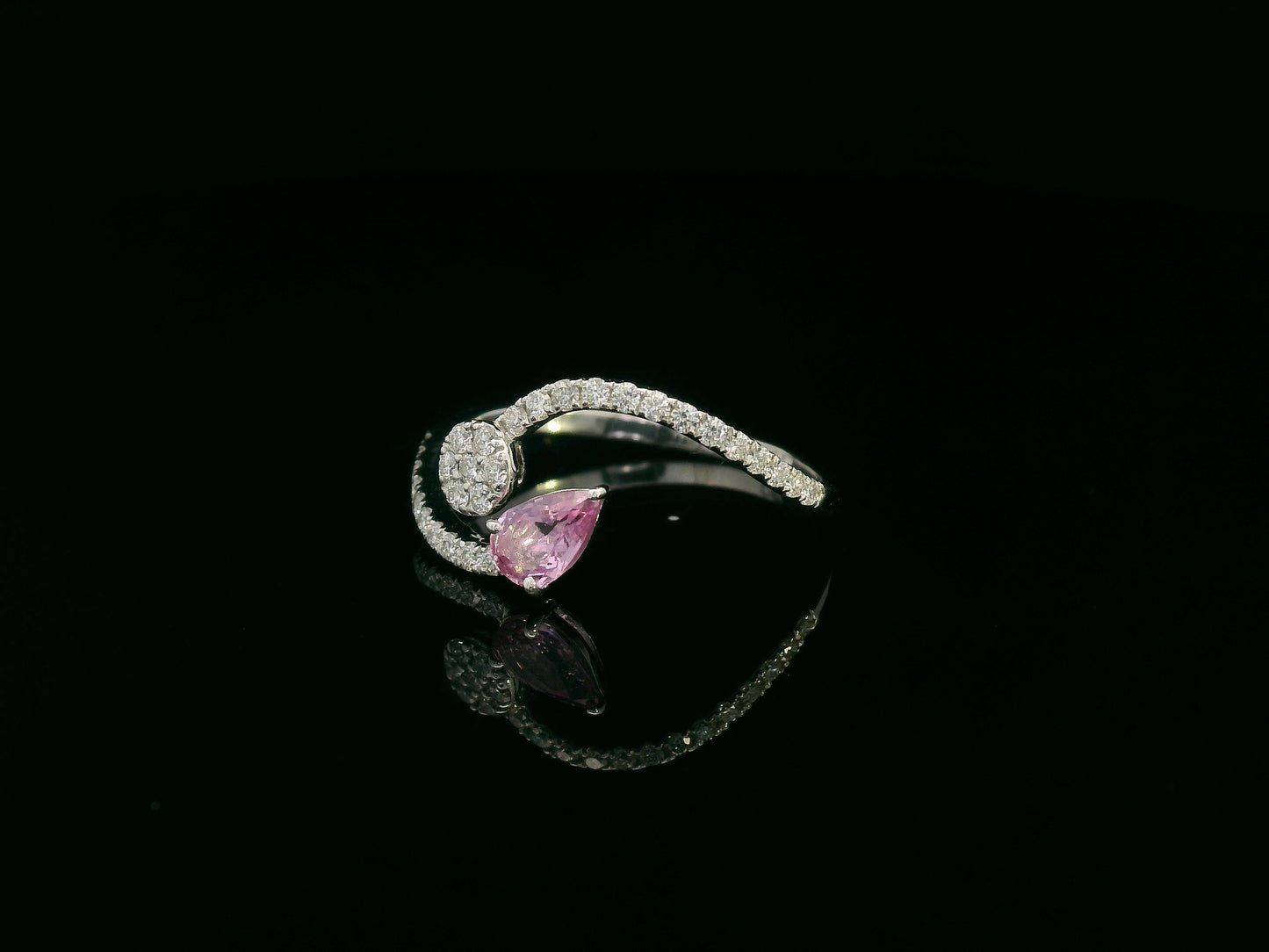 18K white gold bypass ring with pear-cut pink sapphire and diamond cluster