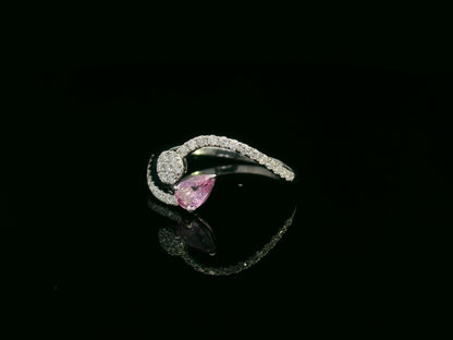 18K white gold bypass ring with pear-cut pink sapphire and diamond cluster