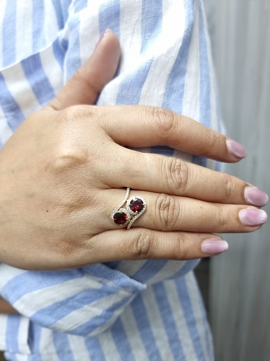 18K yellow gold double halo bypass ring with 2.79 carat red garnets and 0.33 carat diamonds, toi et moi statement design