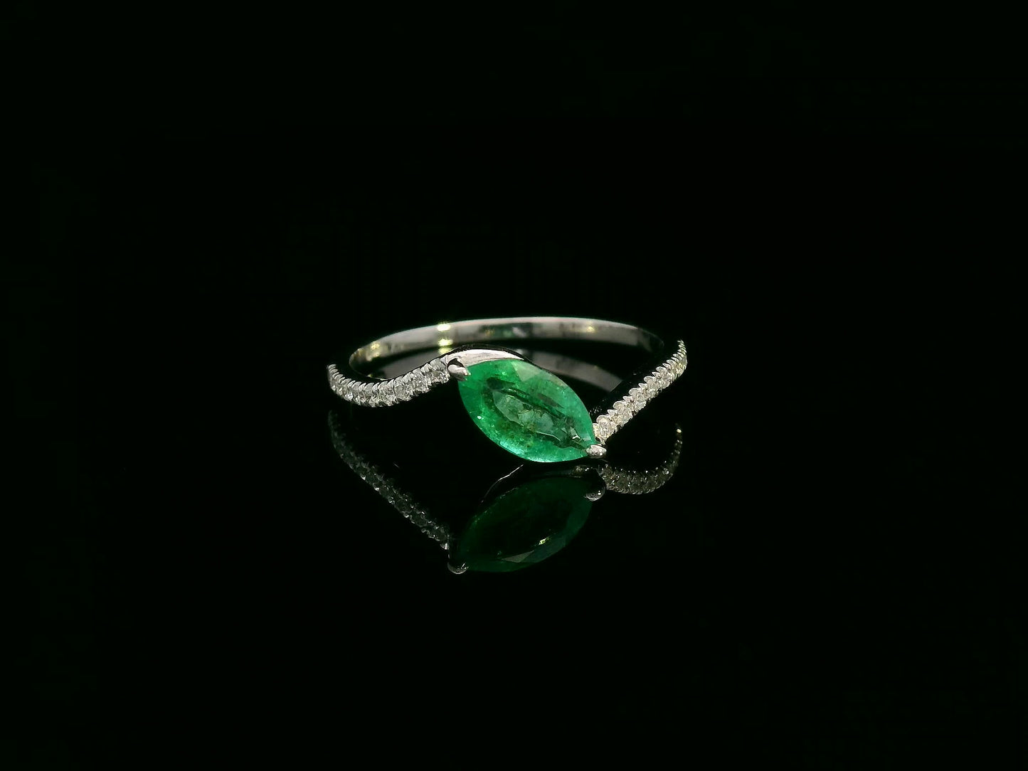 18K white gold emerald and diamond crossover ring with marquise-cut 0.65 carat emerald